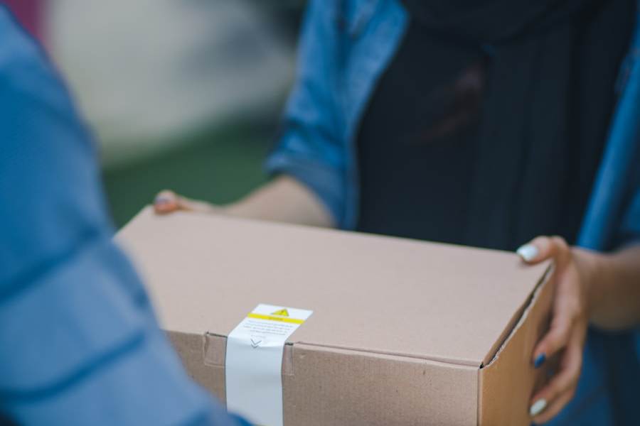 A parcel being handed to a customer