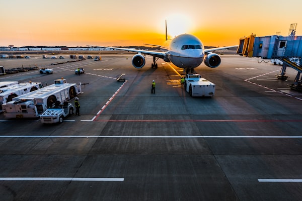 Aircraft being loaded on the apron at sunset