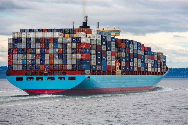 Container ship loaded with freight under way