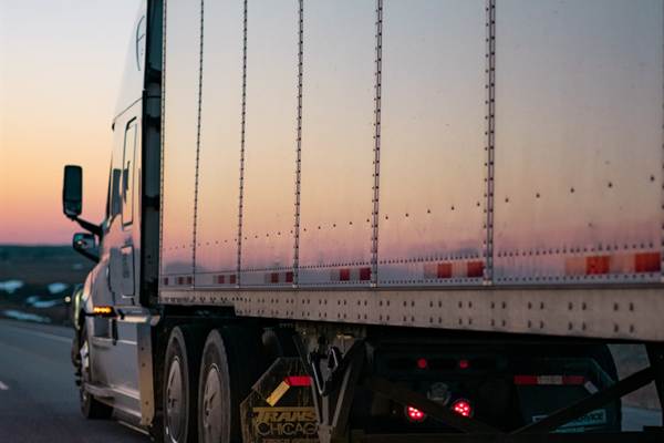 Articulated lorry on the highway at dusk